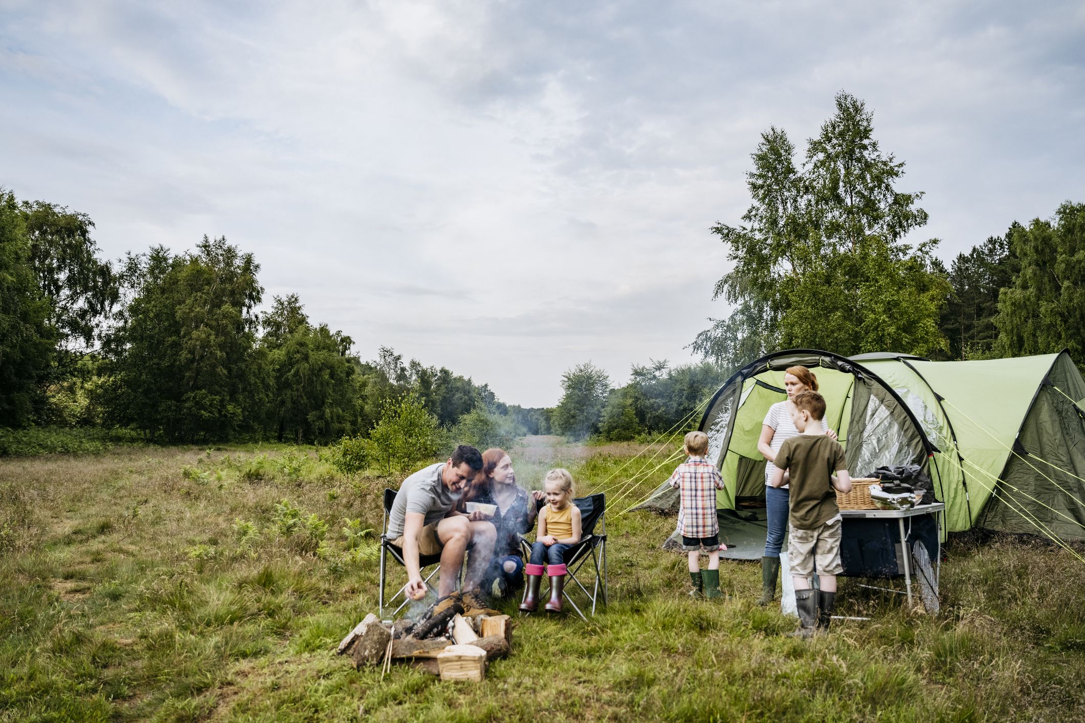 Front Page -Camping Hardware Sales father and mother with children on springtime royalty free image 1679951436